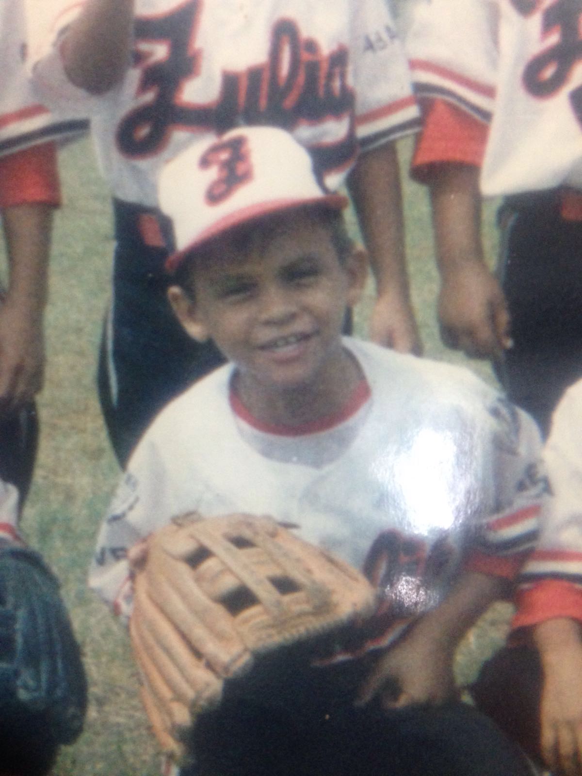 Young boy playing baseball in Venezuela